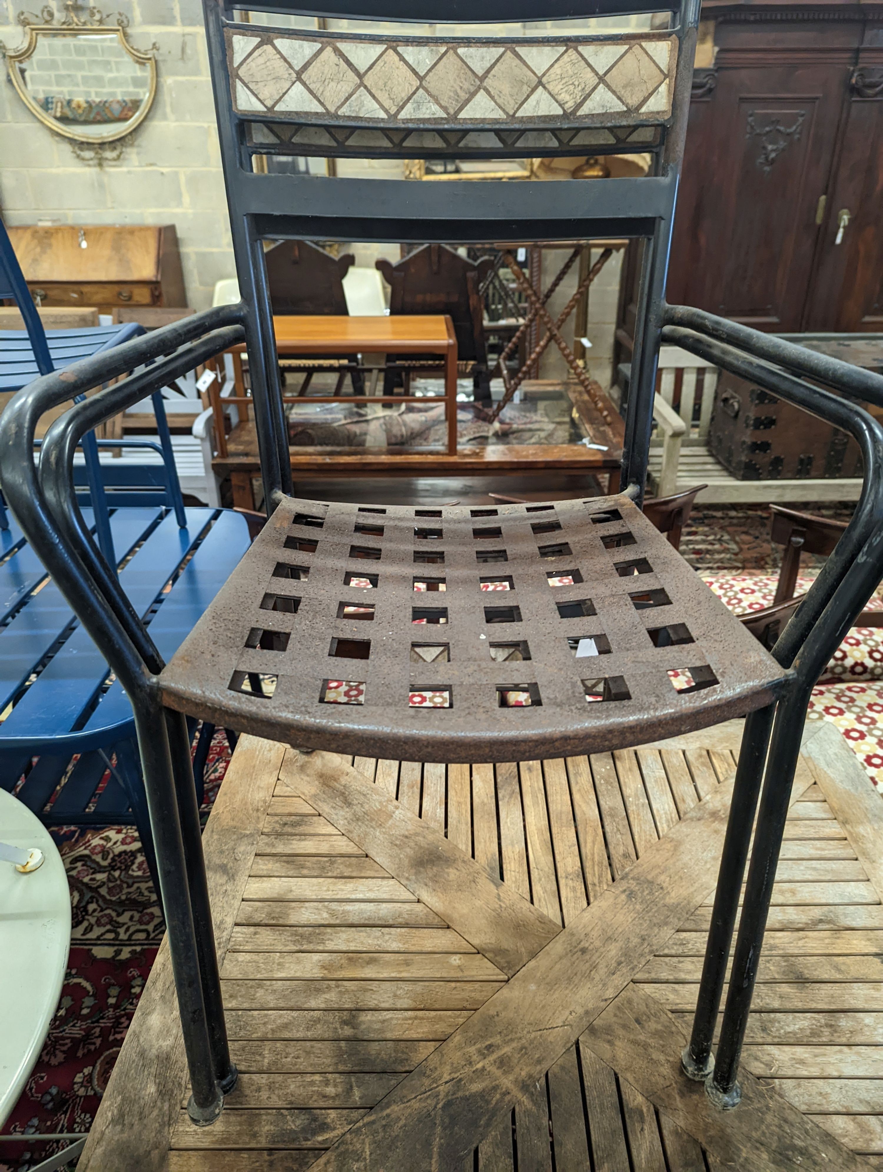 A square teak garden table, width 89cm, height 74cm and four metal garden chairs